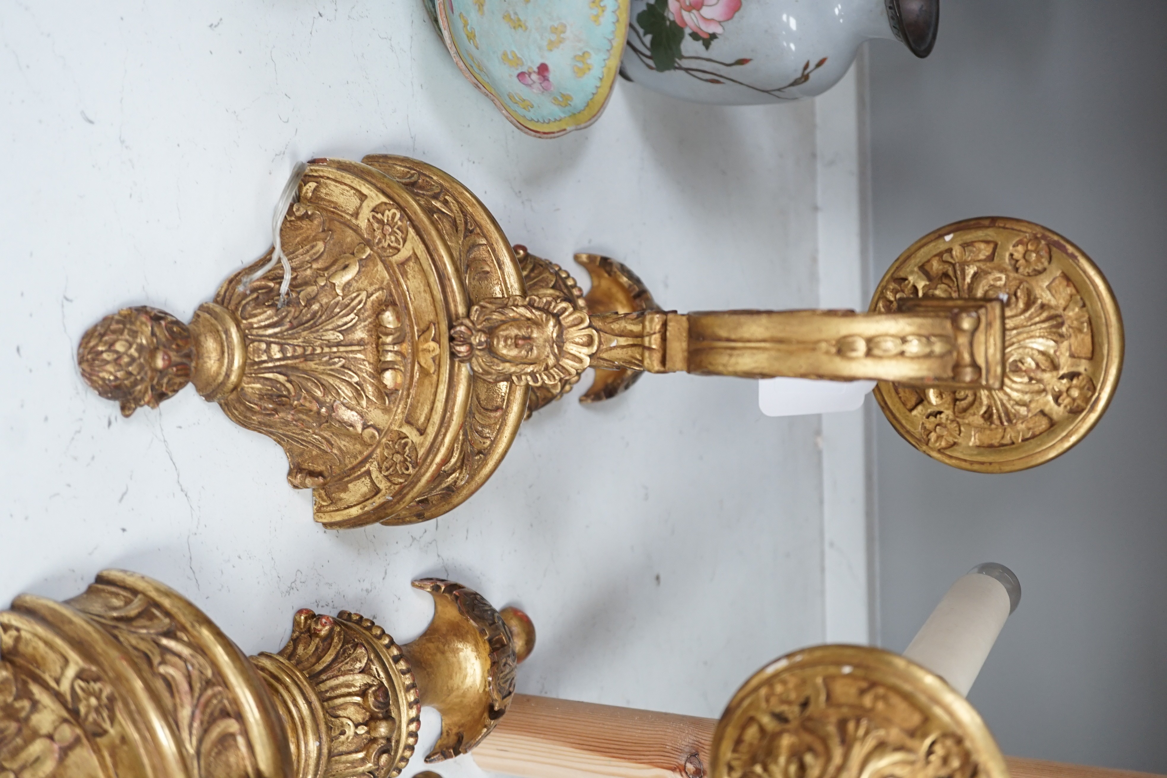 A pair of giltwood decorative single branch wall sconces - approx 50cm long